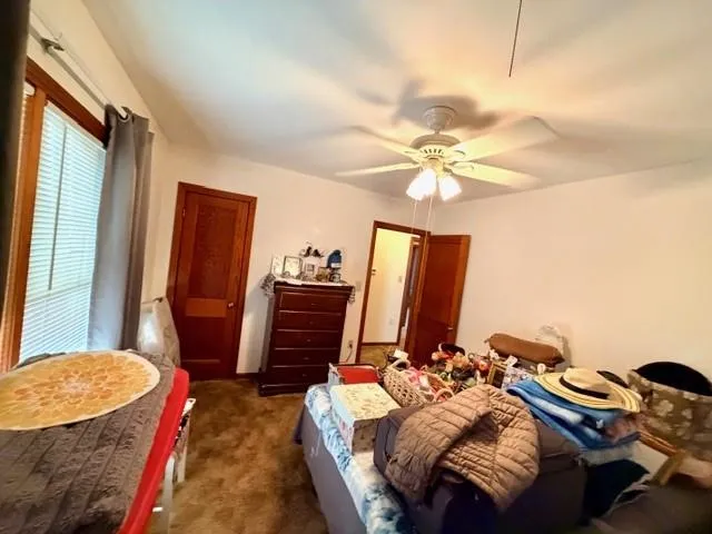 a bed room with a bed and a chandelier