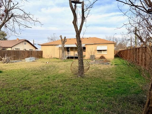 1417 Reynolds Street Goldthwaite, TX 76844 - Photo 20 of 21 a view of a yard with a house