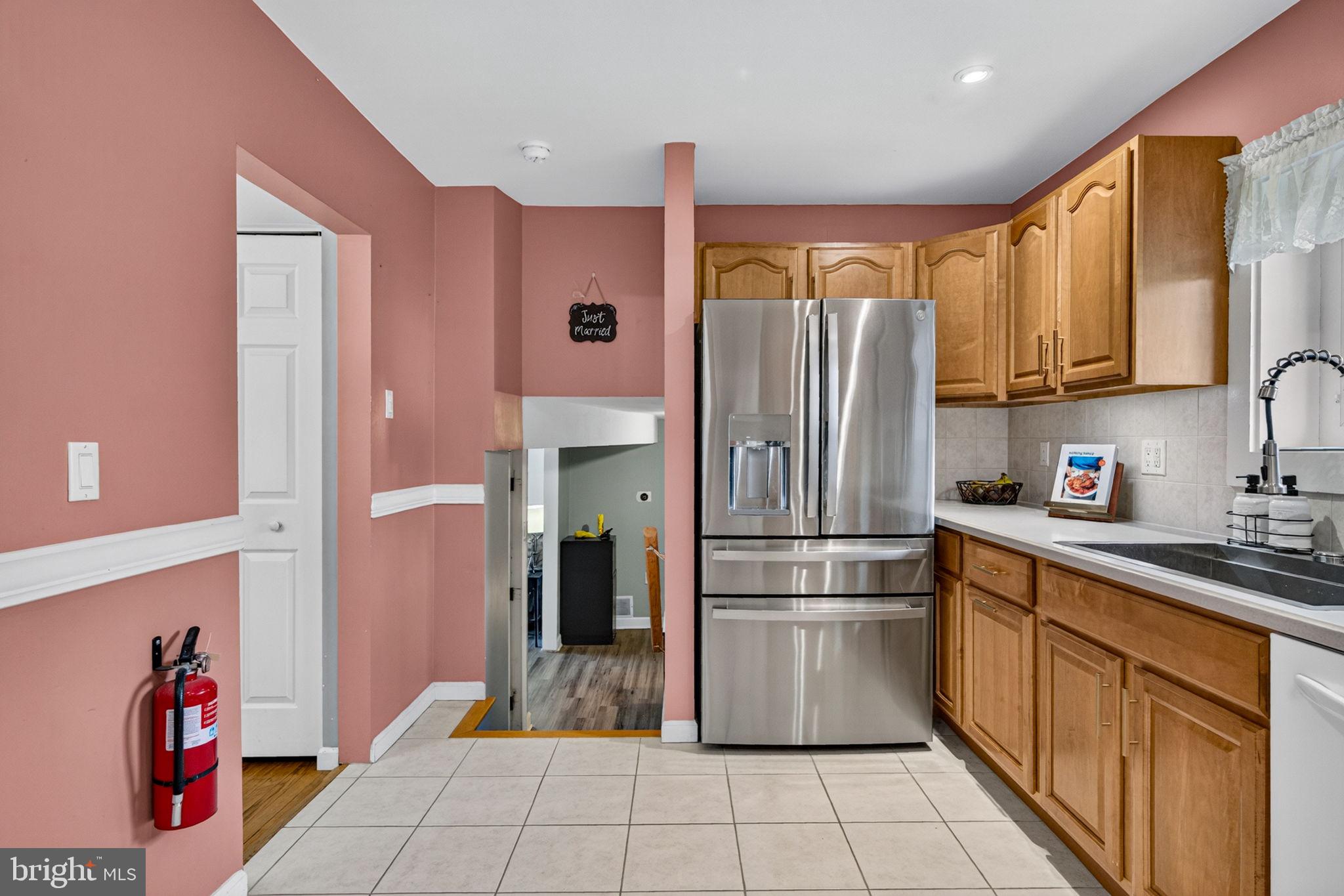 12 Woodbridge Road Gibbsboro, NJ 08026 - Photo 18 of 45 a kitchen with stainless steel appliances granite countertop a refrigerator and a sink