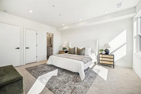 a bedroom with a bed and a dresser