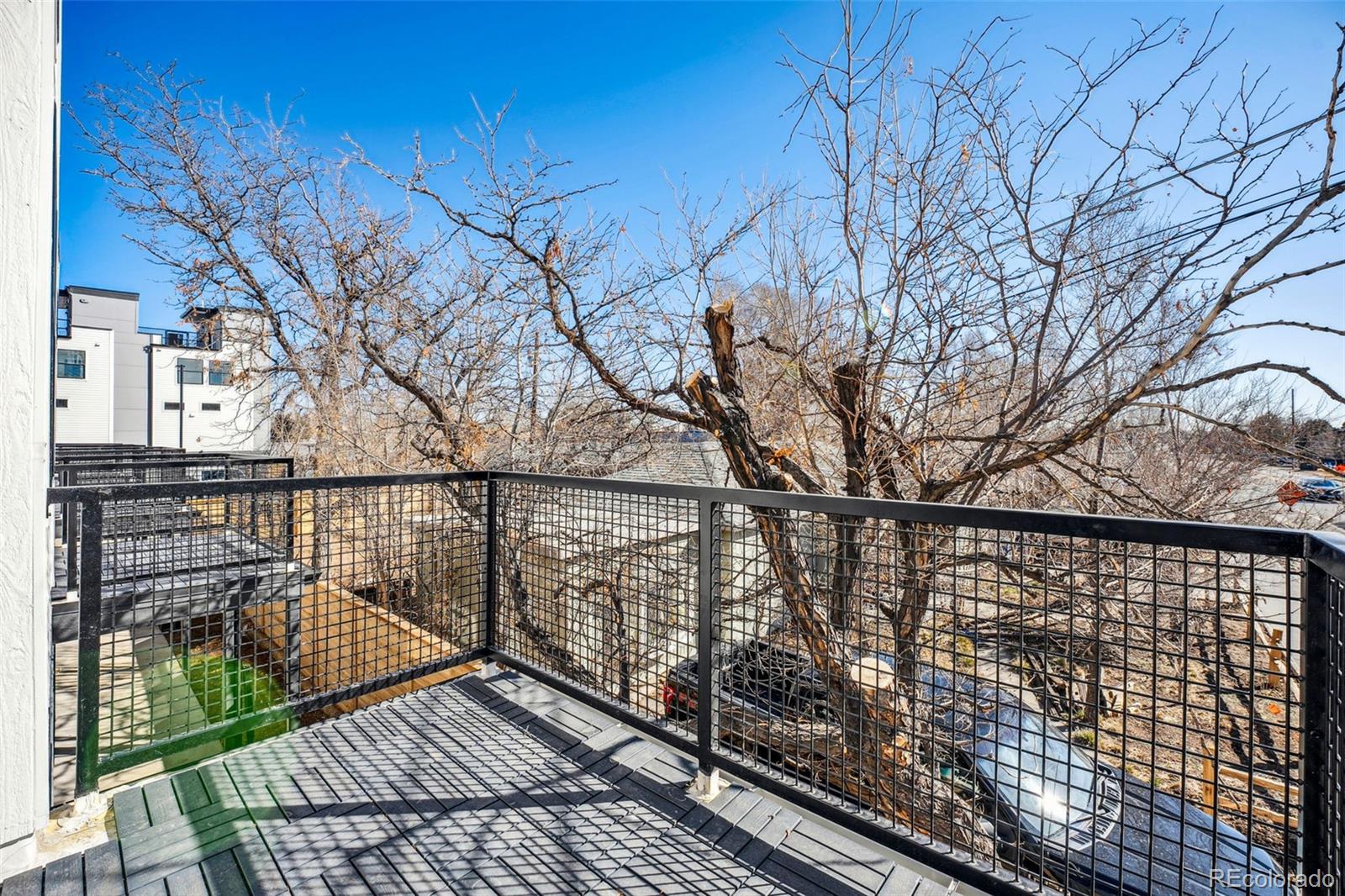1416 Pierce Street Lakewood, CO 80214 - Photo 28 of 38 a view of balcony with wooden floor and fence