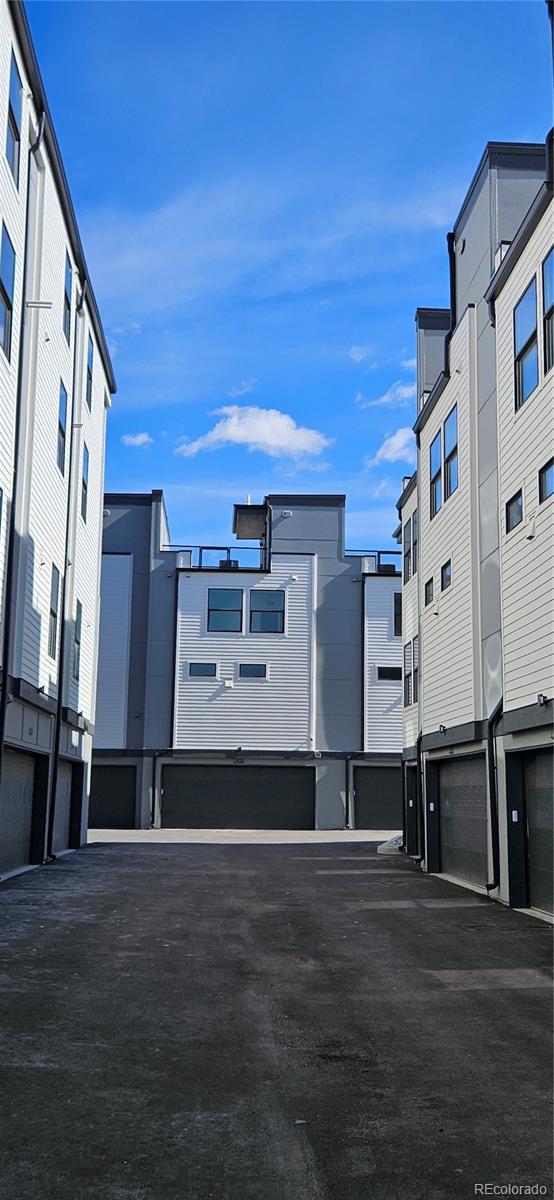 1416 Pierce Street Lakewood, CO 80214 - Photo 35 of 38 a front view of a building with many windows