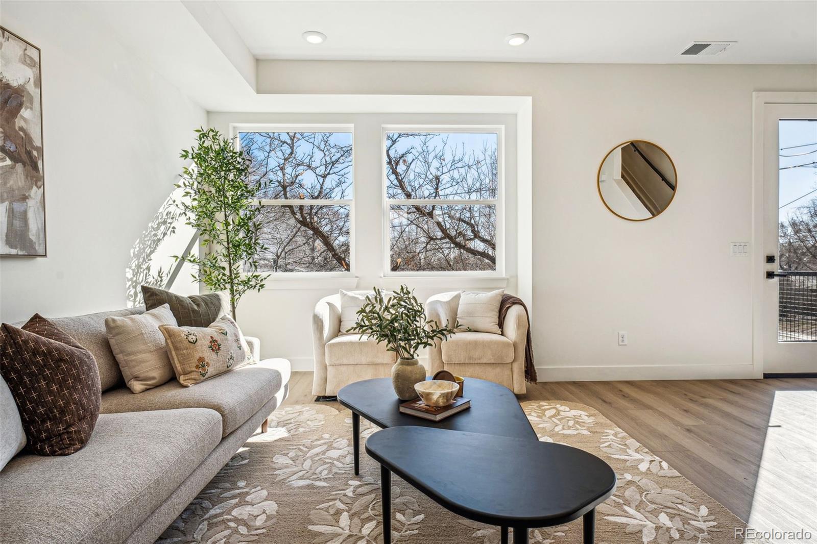 1416 Pierce Street Lakewood, CO 80214 - Photo 4 of 38 a living room with furniture potted plant and a large window