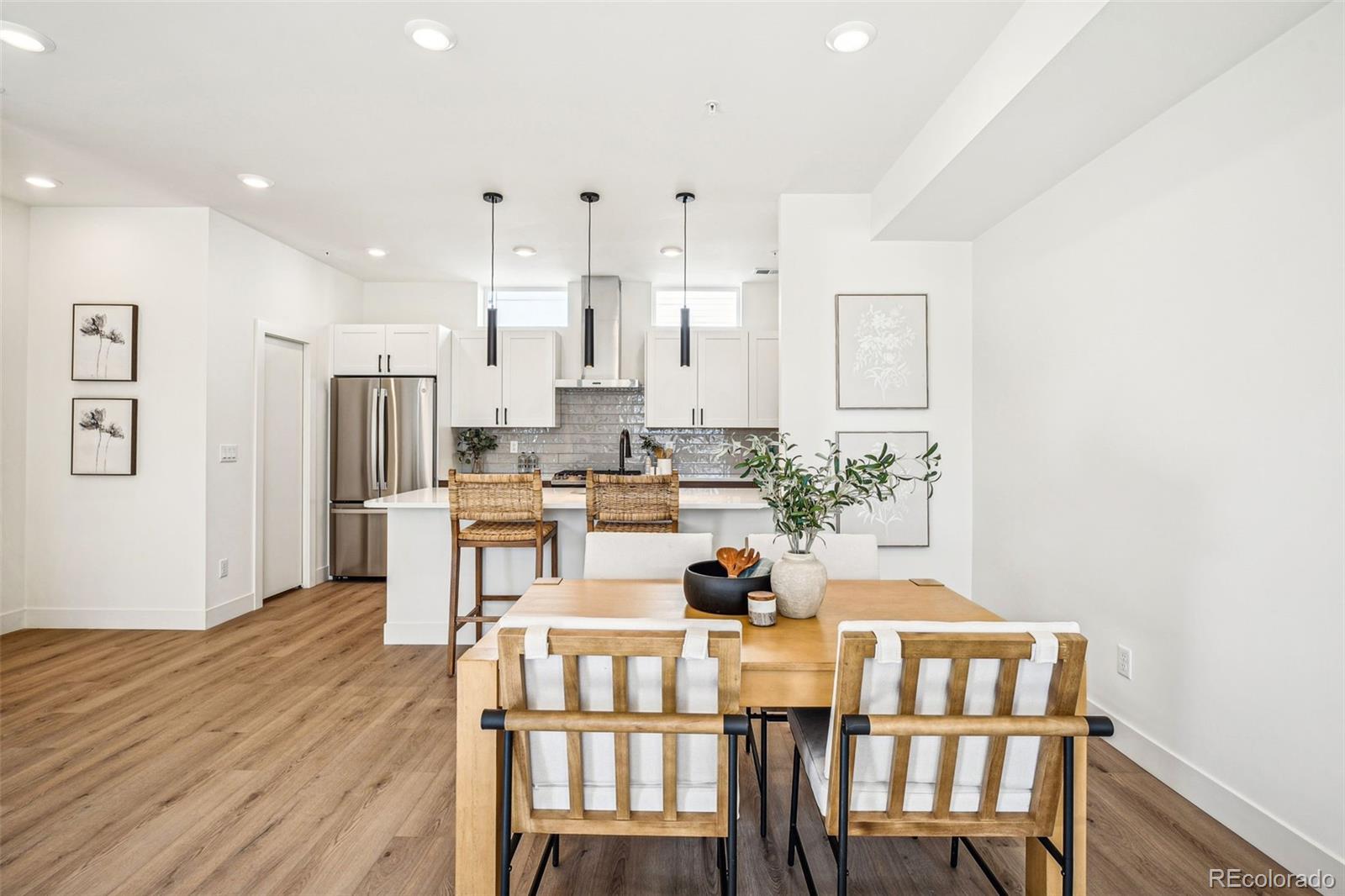 1416 Pierce Street Lakewood, CO 80214 - Photo 6 of 38 a view of a dining room with furniture and wooden floor