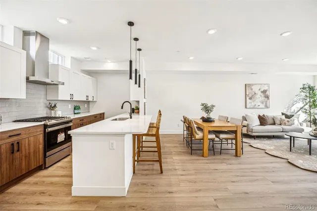 a view of kitchen with cabinets and wooden floor