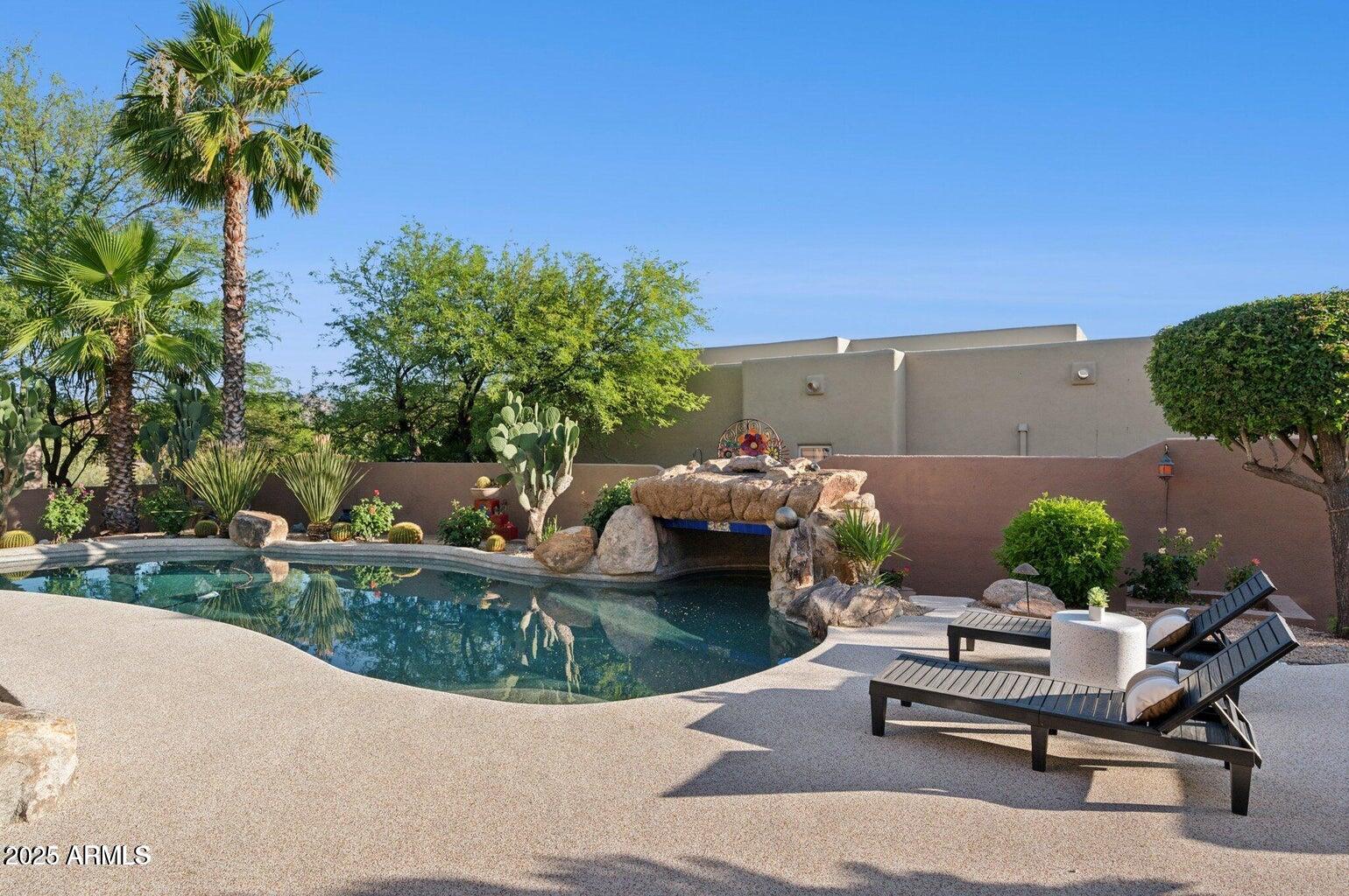 11299 East Greythorn Drive Scottsdale, AZ 85262 - Photo 12 of 13 a view of a backyard with furniture and a garden