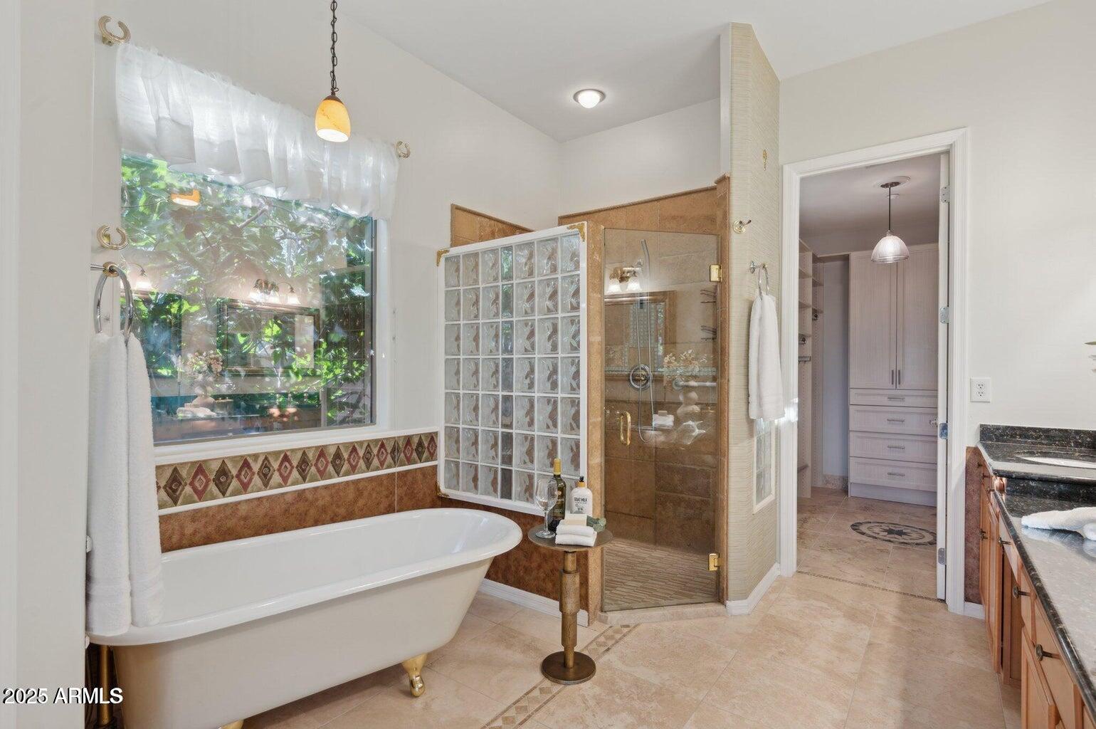 11299 East Greythorn Drive Scottsdale, AZ 85262 - Photo 5 of 13 a bathroom with a bathtub and a shower