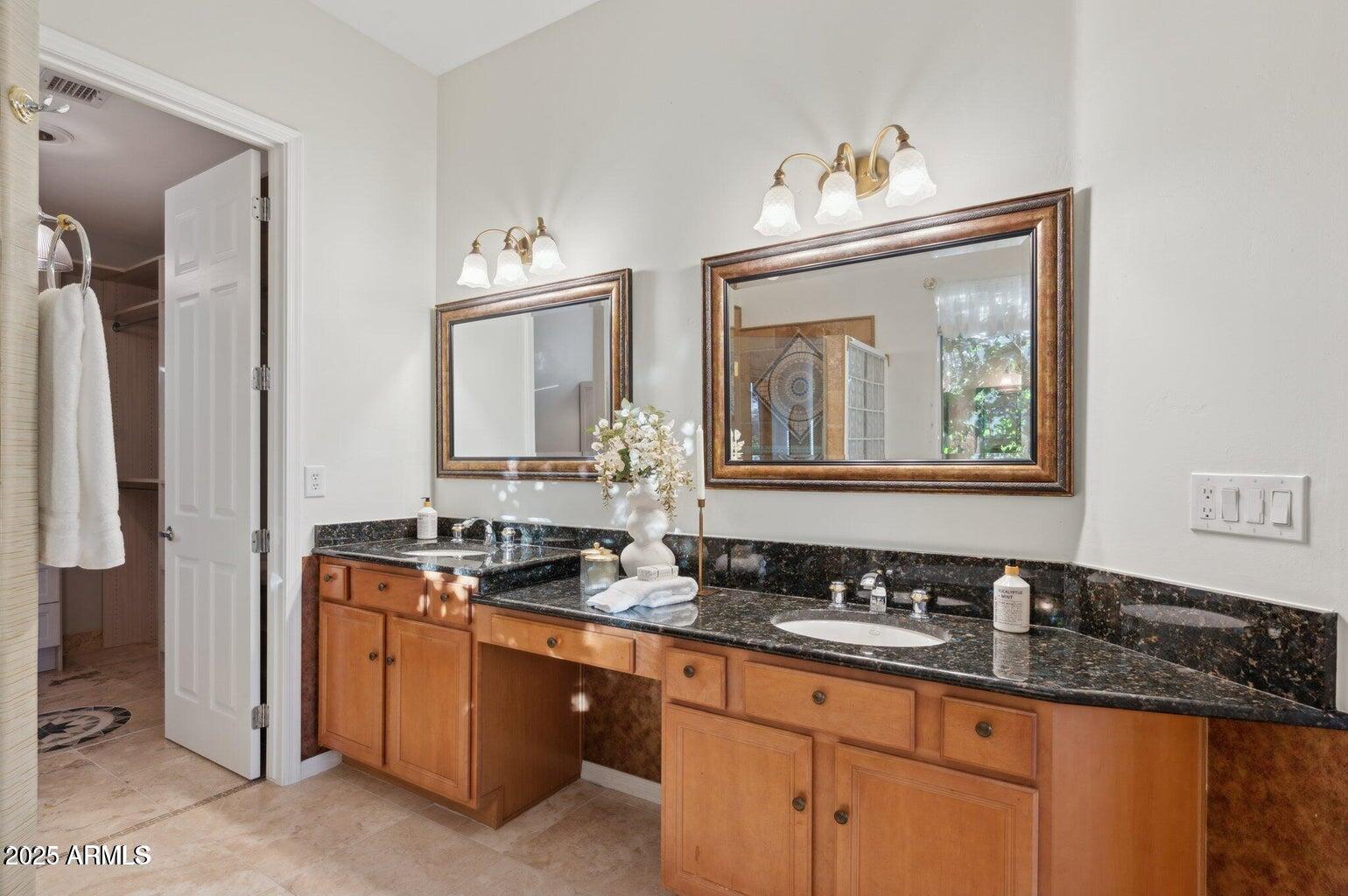 11299 East Greythorn Drive Scottsdale, AZ 85262 - Photo 6 of 13 a bathroom with double sink and a mirror