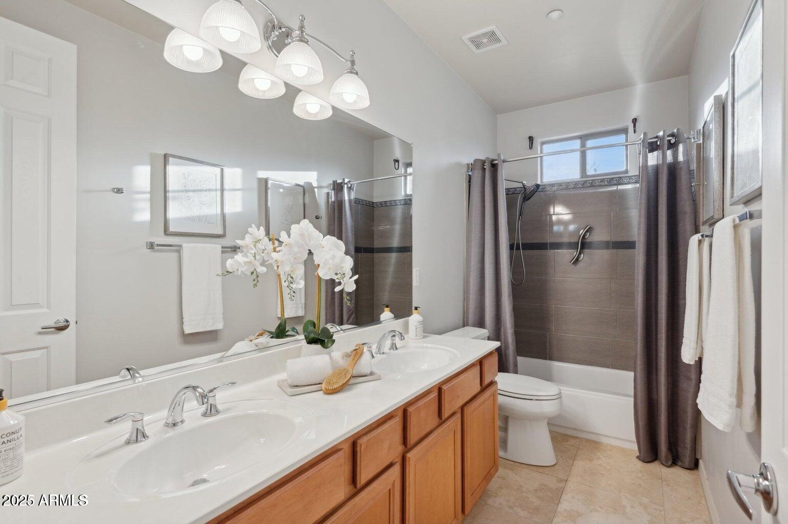 11299 East Greythorn Drive Scottsdale, AZ 85262 - Photo 9 of 13 a bathroom with a double vanity sink mirror and toilet