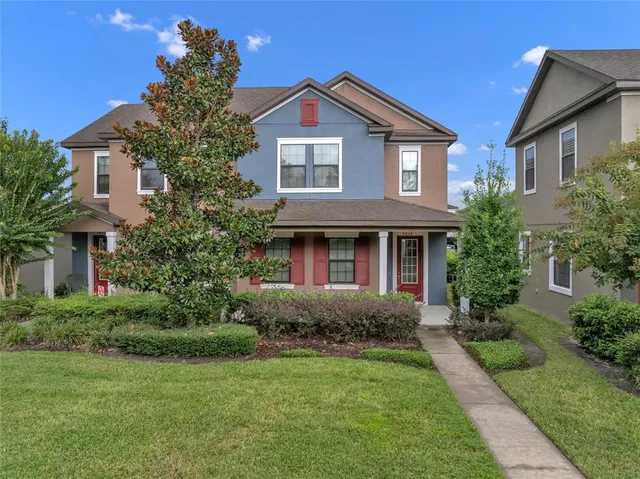 a front view of a house with garden