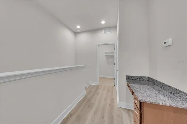 a view of a kitchen from the hallway