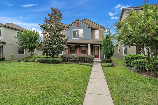 a front view of a house with yard