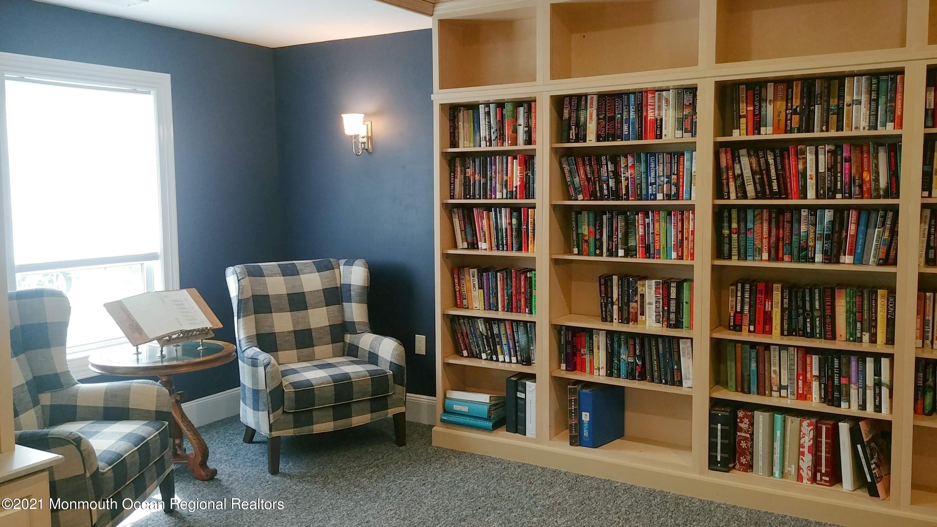 26 Symphony Avenue Bayville, NJ 08721 - Photo 39 of 40 a living room with furniture and a book shelf