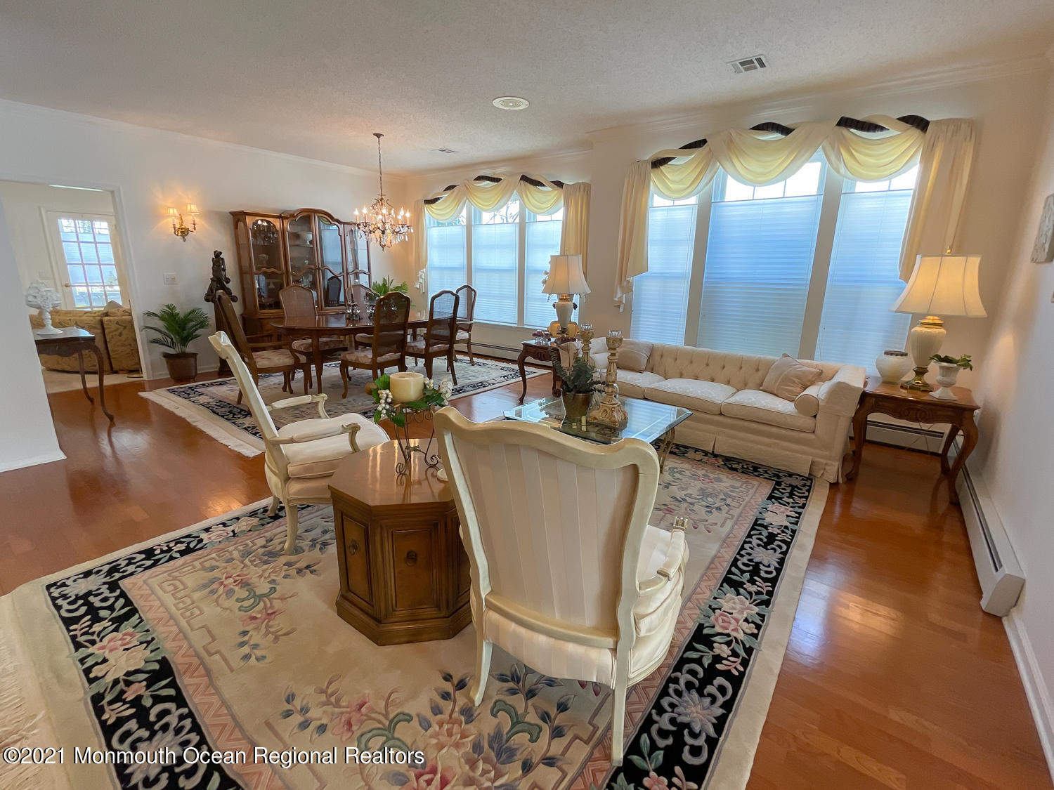 26 Symphony Avenue Bayville, NJ 08721 - Photo 9 of 40 a living room with furniture and a chandelier