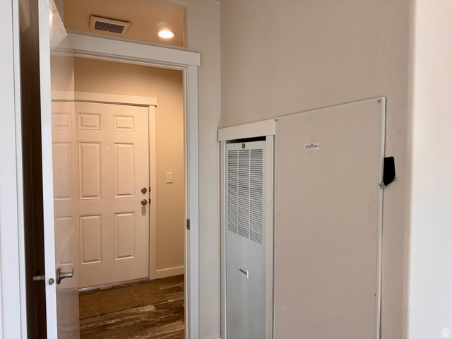 32 Sevier River, Unit 32 Levan, UT 84639 - Photo 26 of 50 View of back door and laundry area from the hallway. Includes forced air electric furnace that is not currently not being used. Currently heated by the propane wall units.