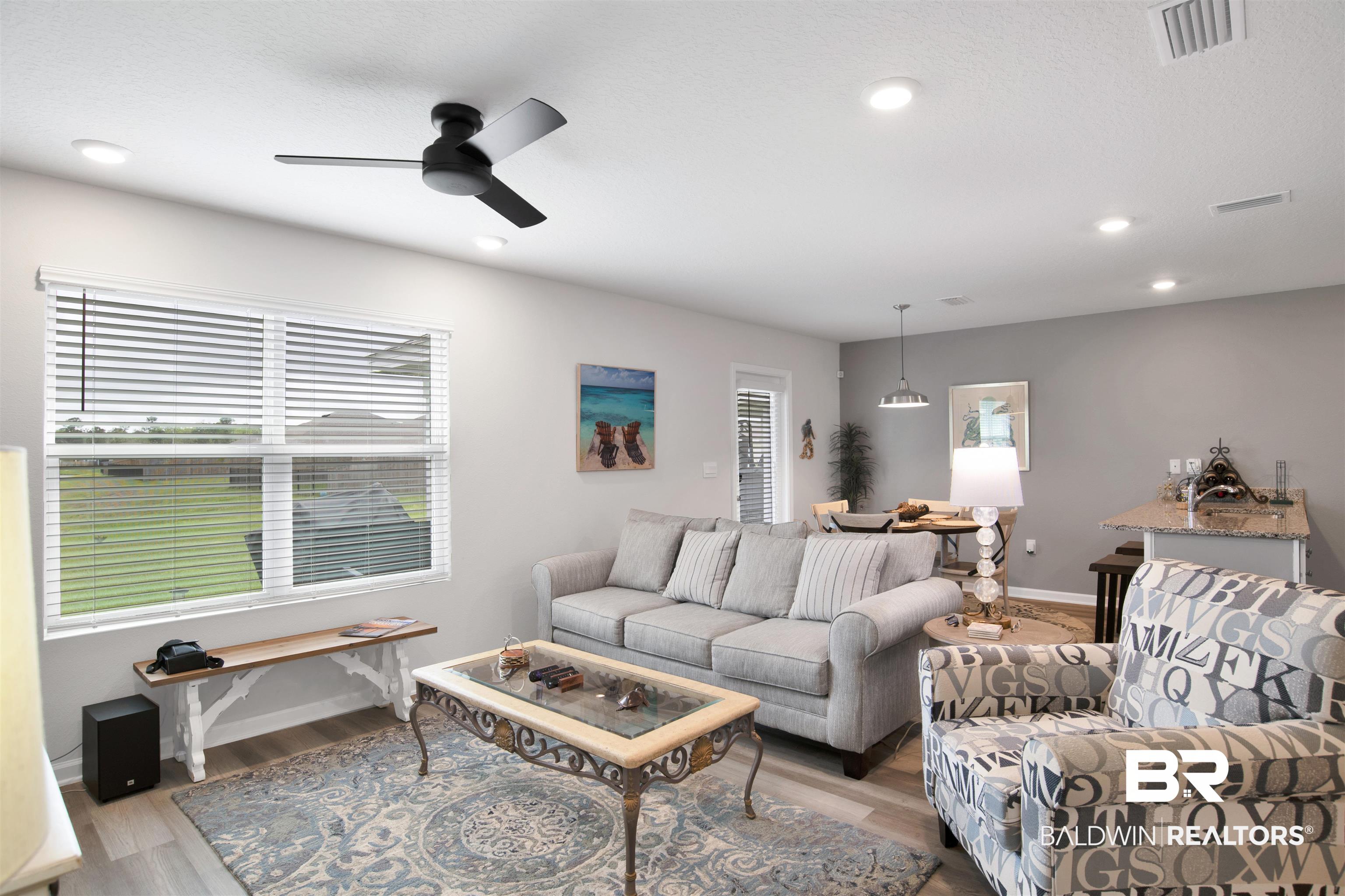 22348 Aleutian Avenue Foley, AL 36535 - Photo 8 of 32 Living area featuring wood finished floors, a ceiling fan, plenty of natural light, and recessed lighting
