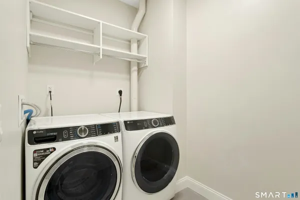 a utility room with dryer and washer