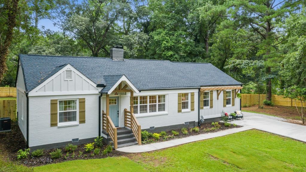 3164 Leeland Road Decatur, GA 30032 - Photo 1 of 1 a front view of a house with a yard