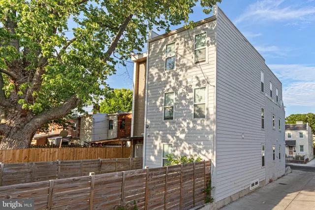 a view of a house with a tree