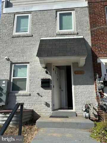 a front view of a house with parking space
