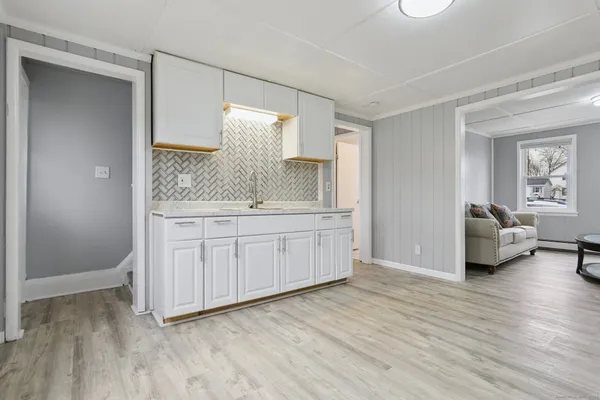 a en suite bathroom with a double vanity sink and a mirror