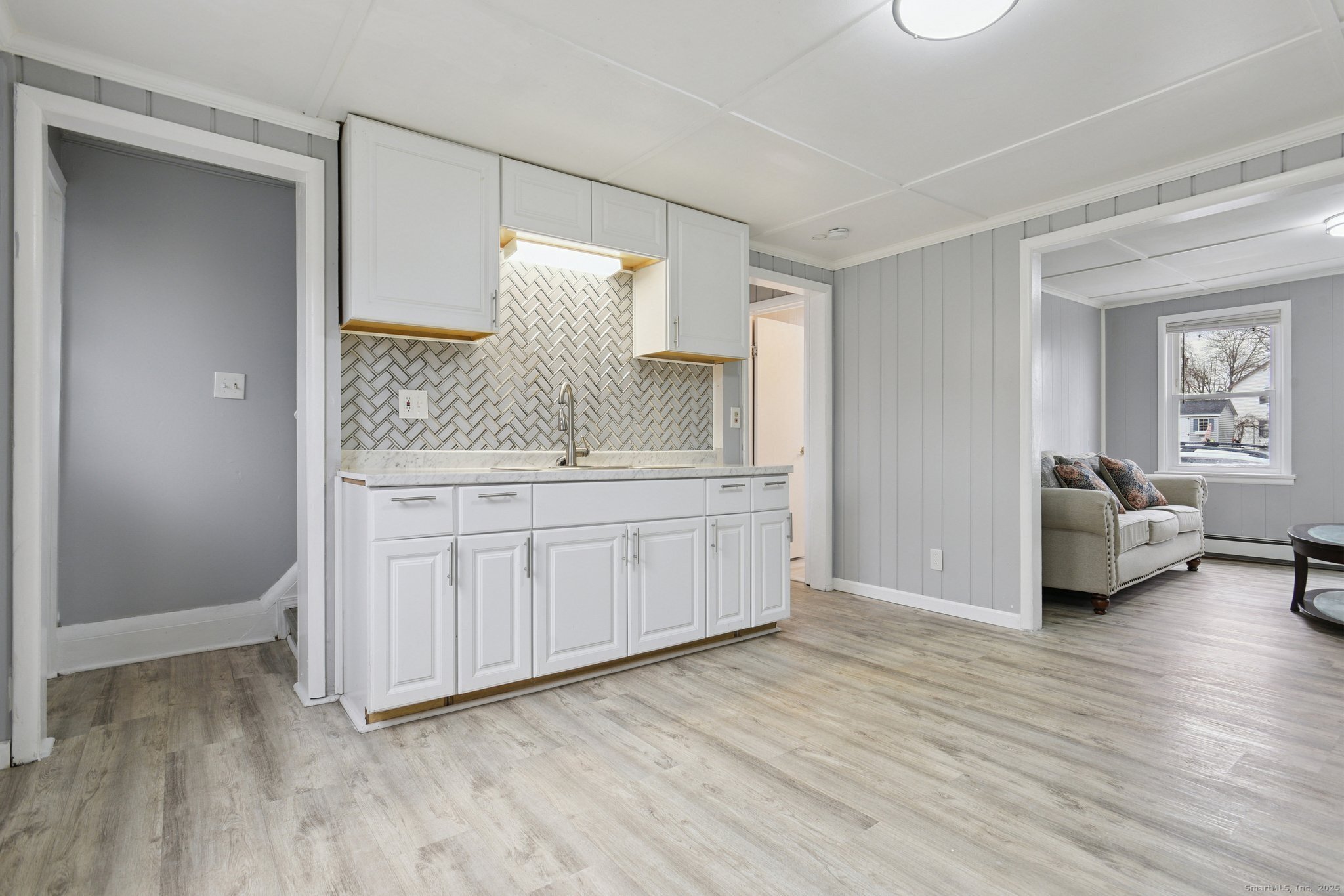 8 3rd Street Norwich, CT 06360 - Photo 22 of 39 a en suite bathroom with a double vanity sink and a mirror