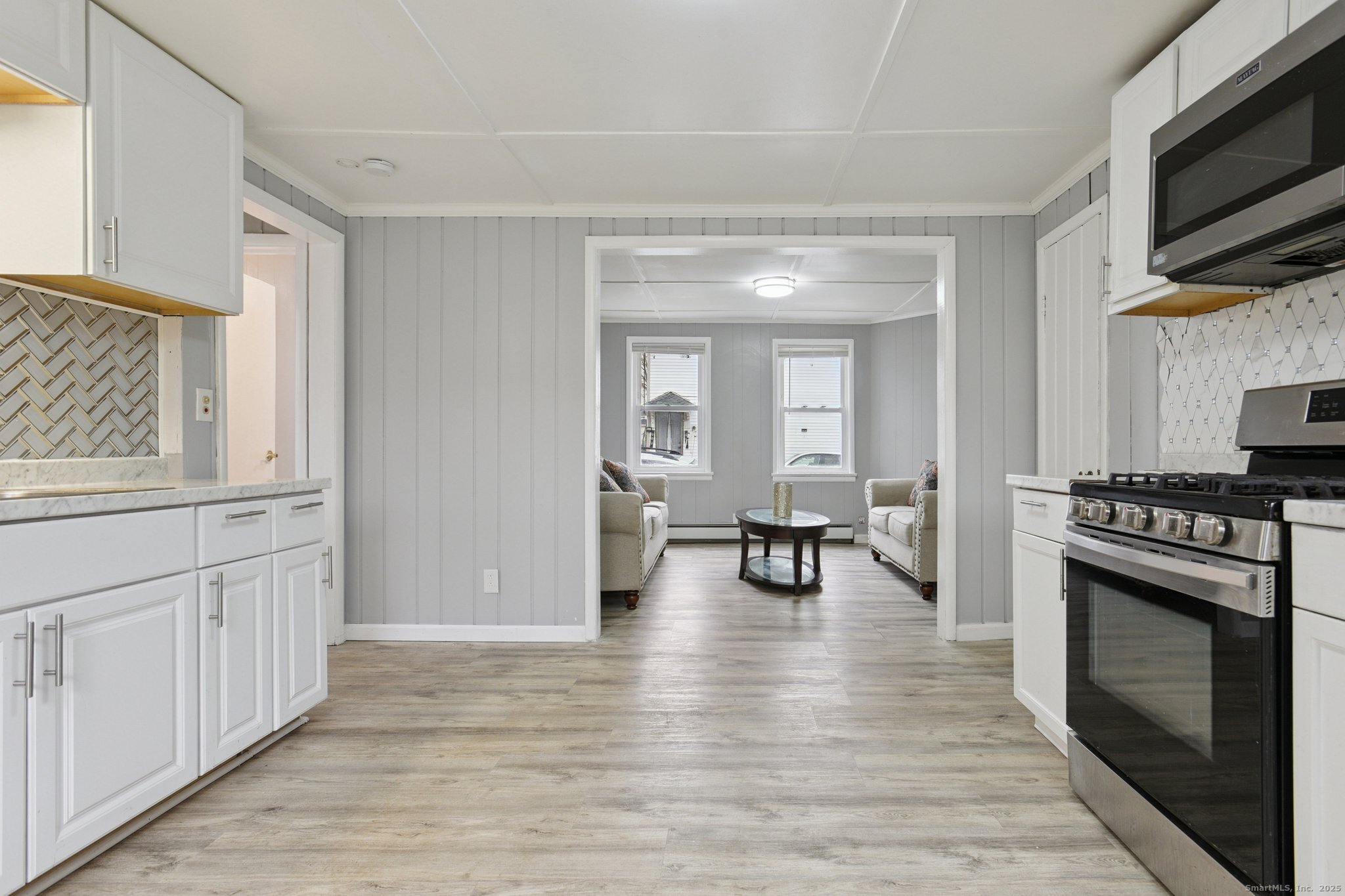 8 3rd Street Norwich, CT 06360 - Photo 23 of 39 a view of a kitchen with a sink cabinets and wooden floor