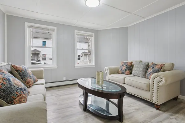 a living room with furniture and a window