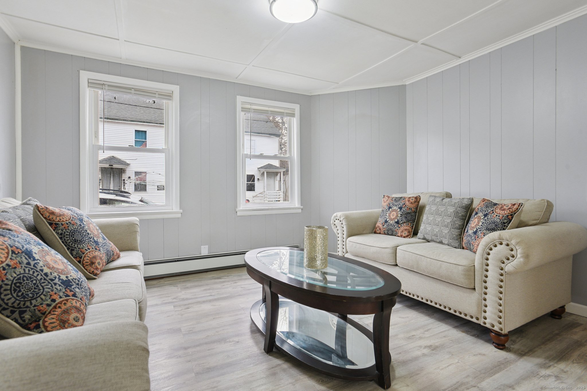 8 3rd Street Norwich, CT 06360 - Photo 26 of 39 a living room with furniture and a window