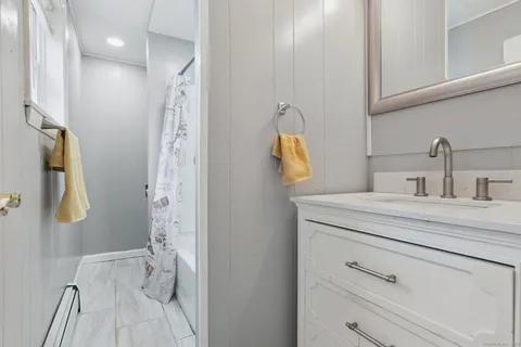 a bathroom with a sink and mirror