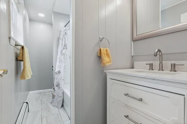 a bathroom with a sink and mirror