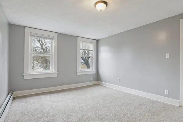 an empty room with windows