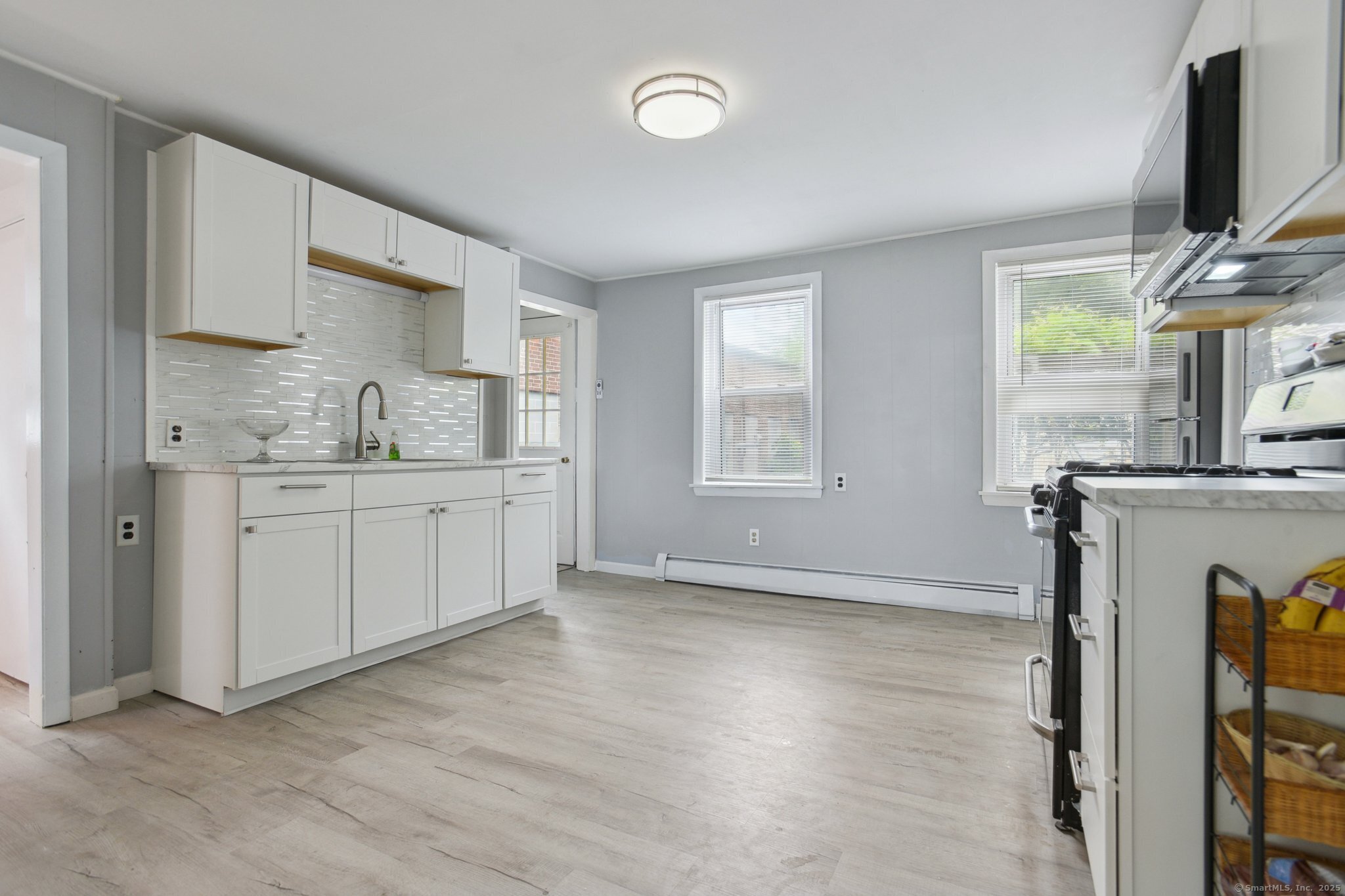 8 3rd Street Norwich, CT 06360 - Photo 7 of 39 a kitchen with a sink cabinets and window