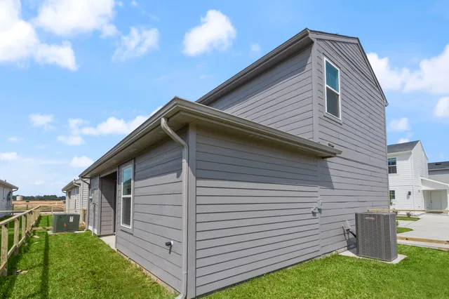 an aerial view of a house with a lake view