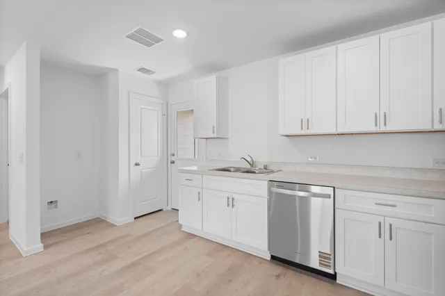 an empty room with a empty space and window