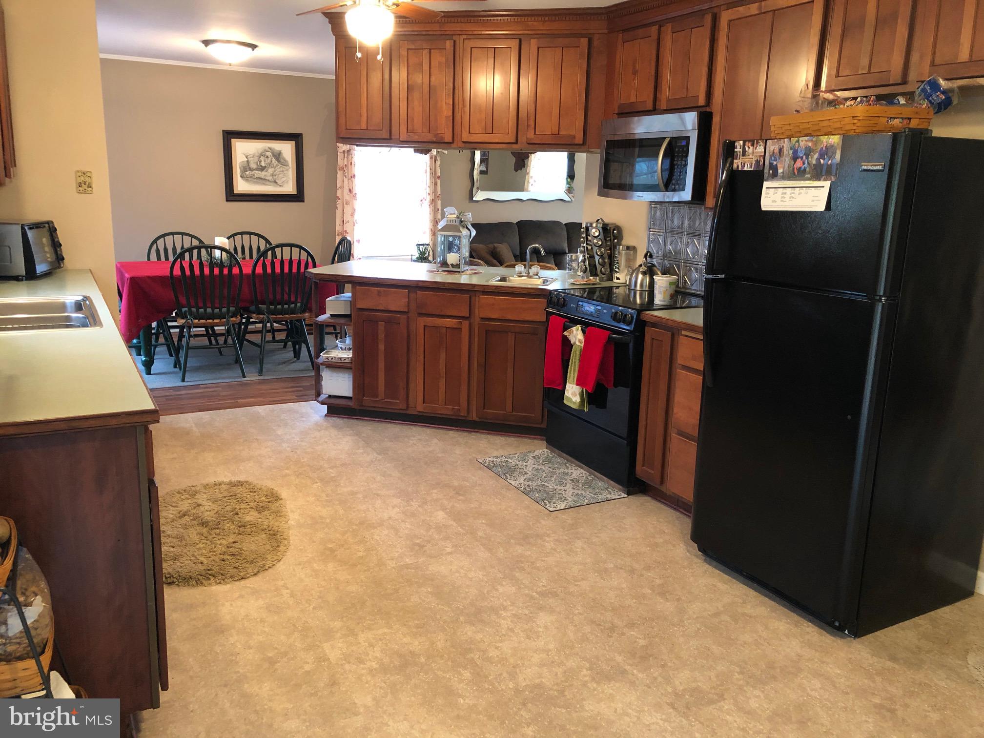 4668 Winding Road New Tripoli, PA 18066 - Photo 10 of 39 Peninsula cabinet with 2 stools