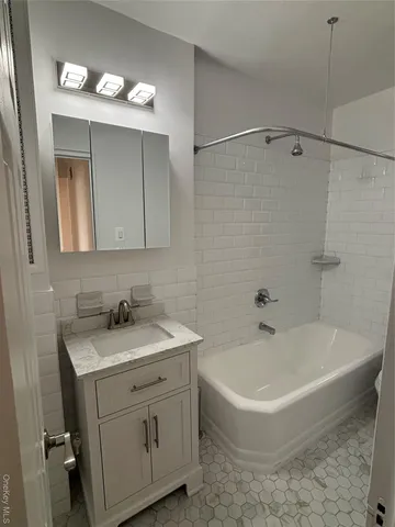a bathroom with a sink and a bathtub
