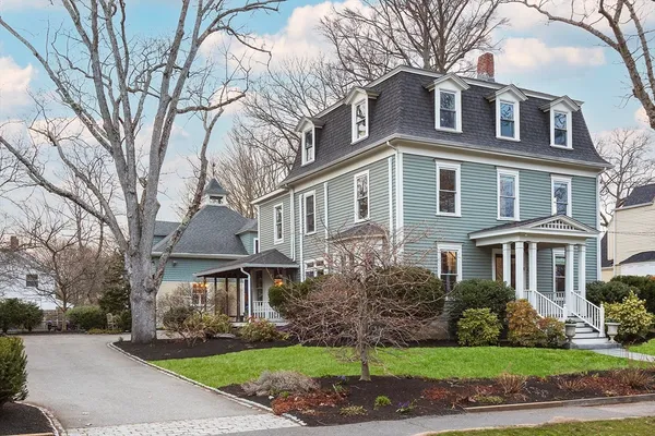 a front view of a building with garden