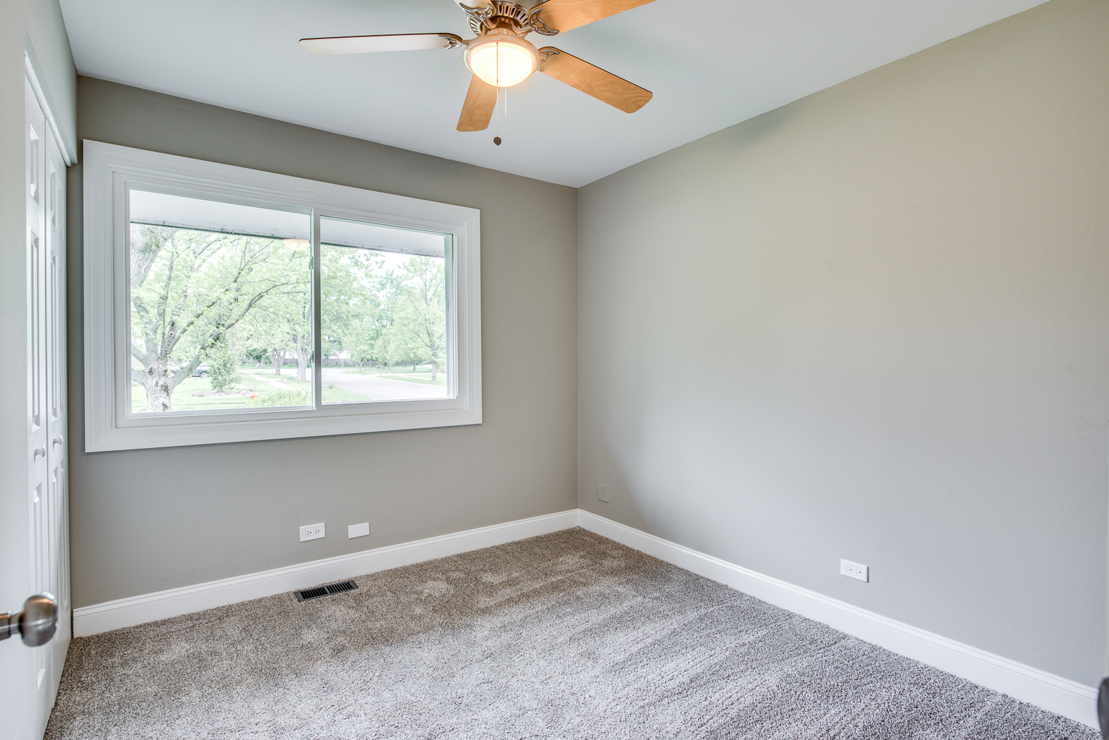 106 Foxcroft Road Naperville, IL 60565 - Photo 13 of 21 an empty room with a window and a fan
