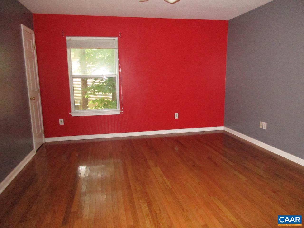 47 Riverside Drive Palmyra, VA 22963 - Photo 8 of 8 an empty room with wooden floor and windows