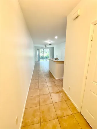 a hallway with a black white checkered floor