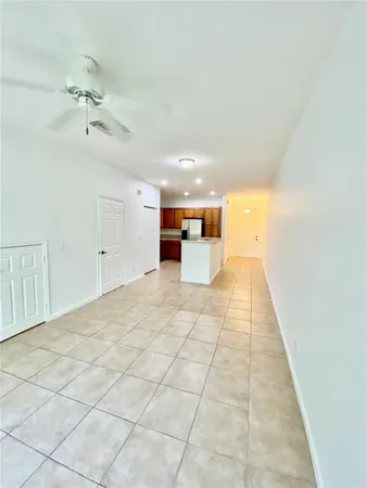 a view of a hallway with a chandelier