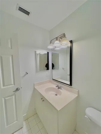 a bathroom with a sink and mirror