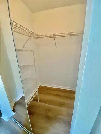 a view of a room with racks on the wall