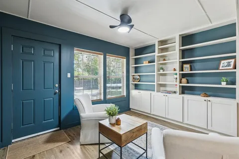 a living room with furniture and a window