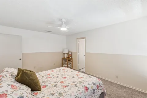 a bedroom with a bed and a cabinets