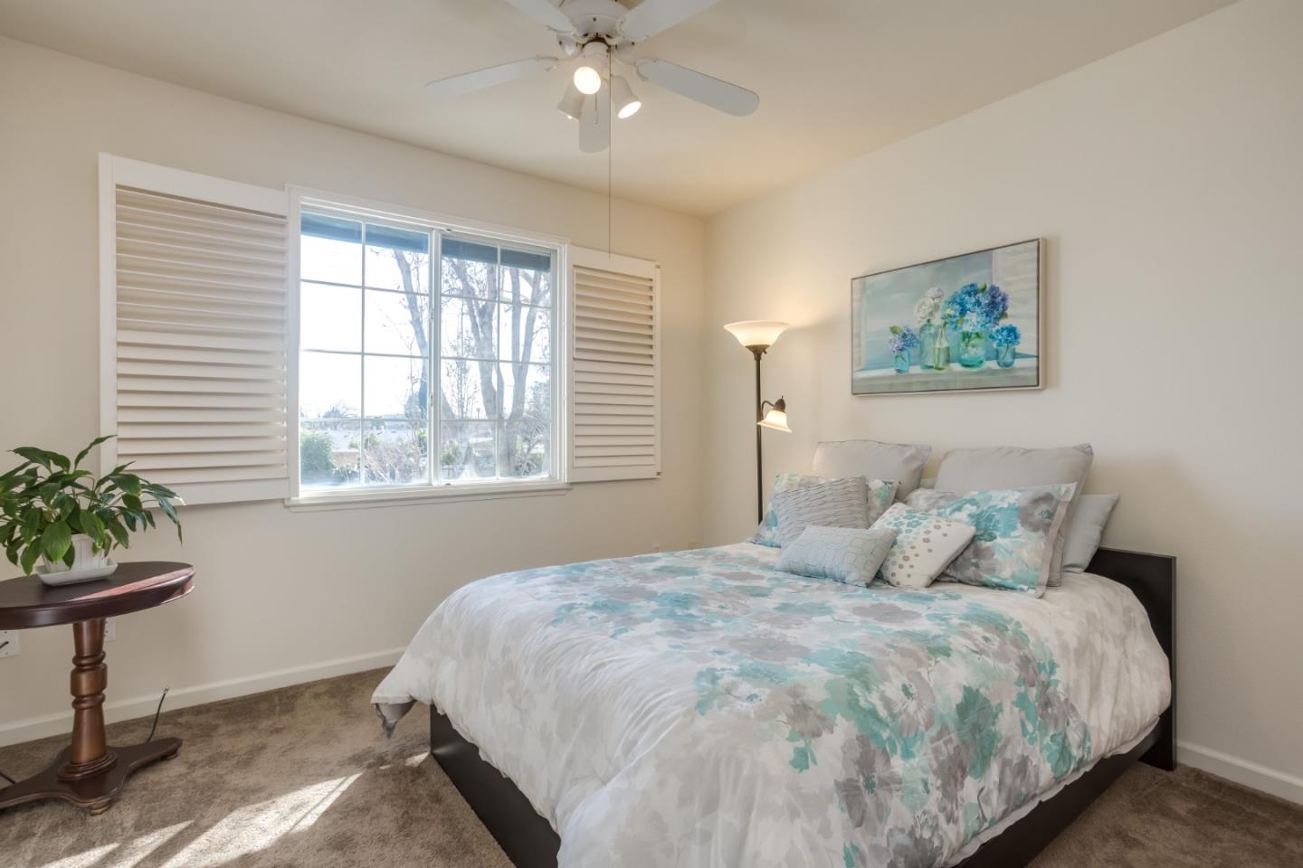 614 Arcadia Terrace, Unit 206 Sunnyvale, CA 94085 - Photo 11 of 21 a bedroom with a bed and window