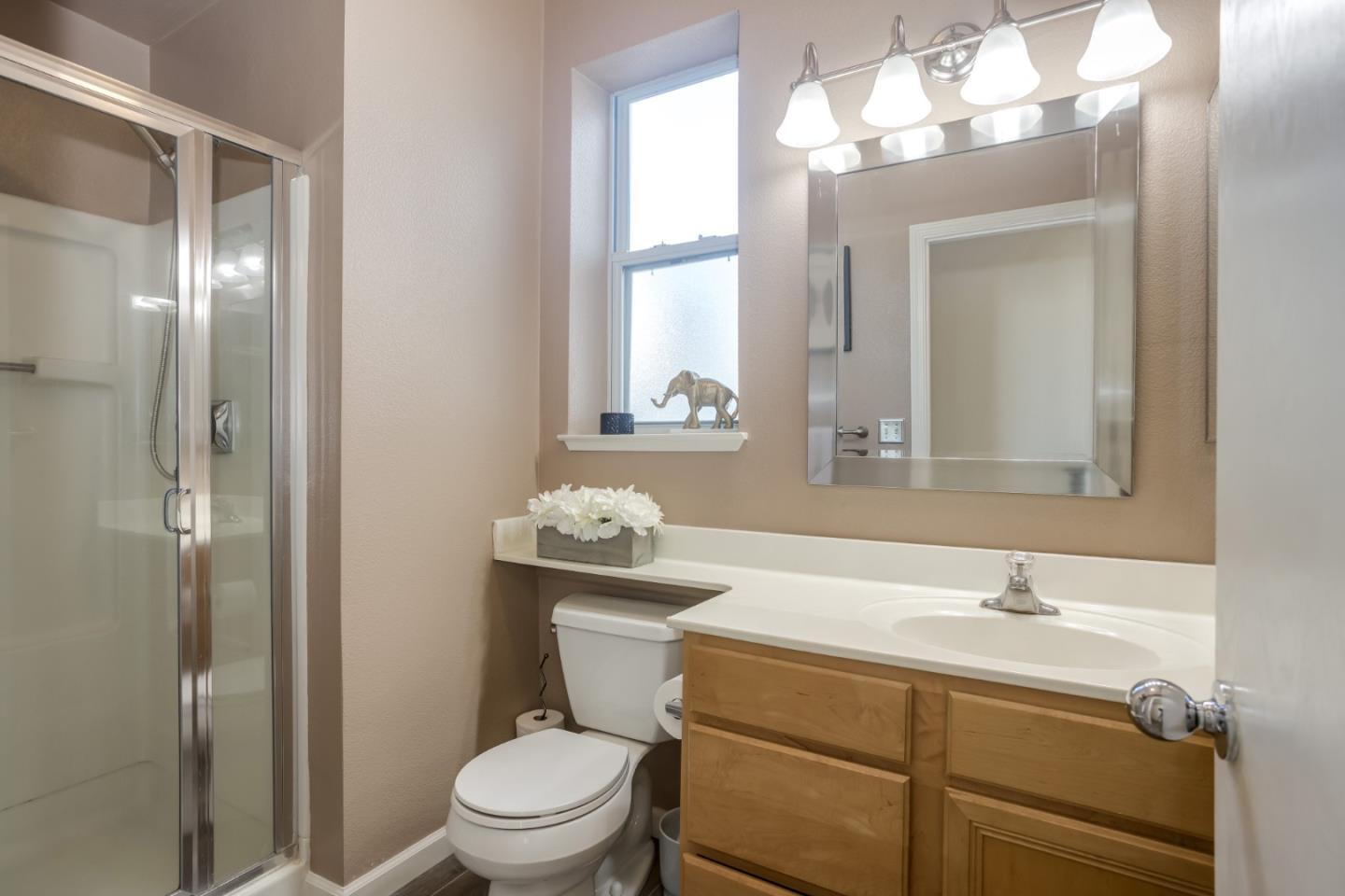 614 Arcadia Terrace, Unit 206 Sunnyvale, CA 94085 - Photo 17 of 21 a bathroom with a sink a toilet and a mirror