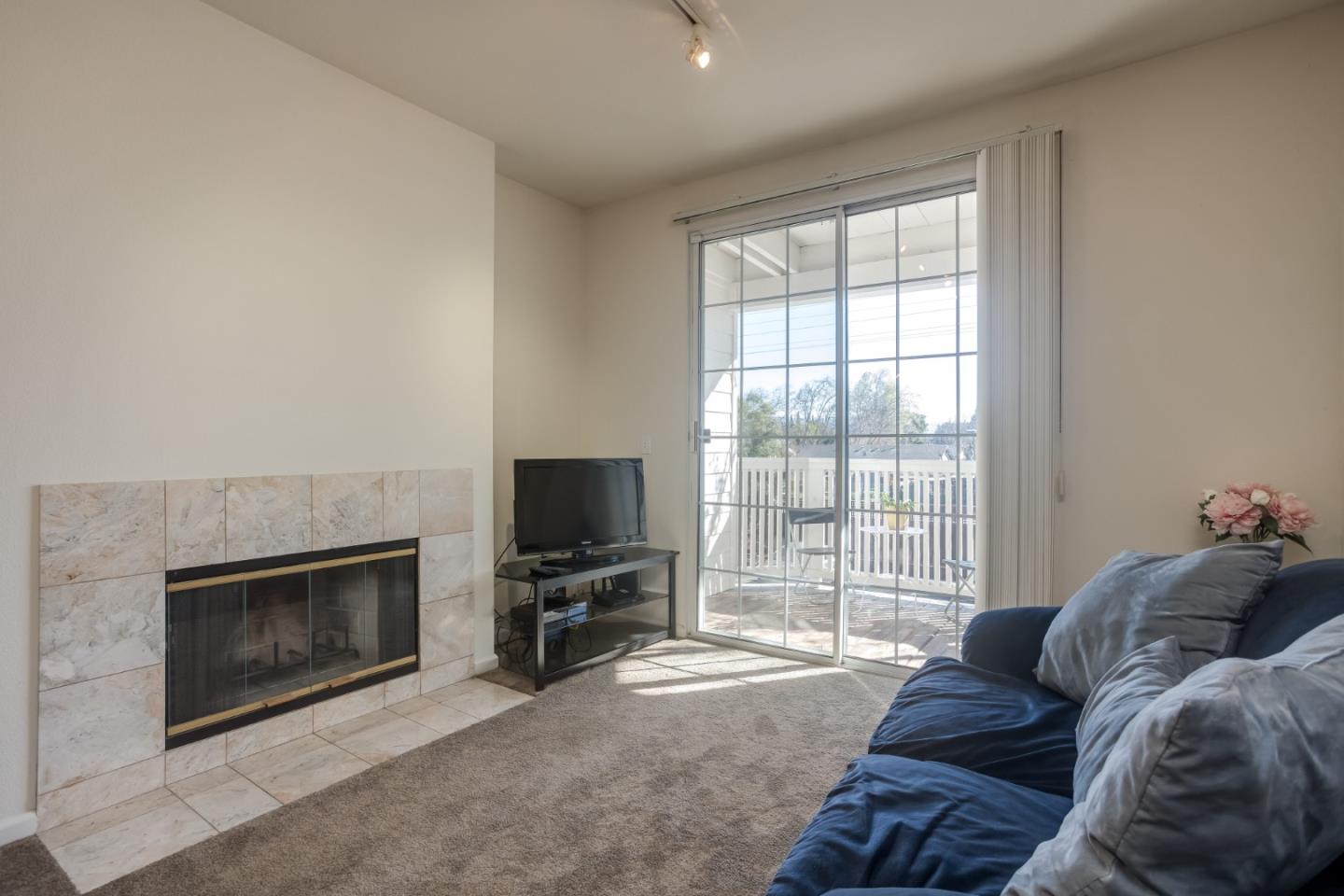 614 Arcadia Terrace, Unit 206 Sunnyvale, CA 94085 - Photo 3 of 21 a bedroom with a bed and a television