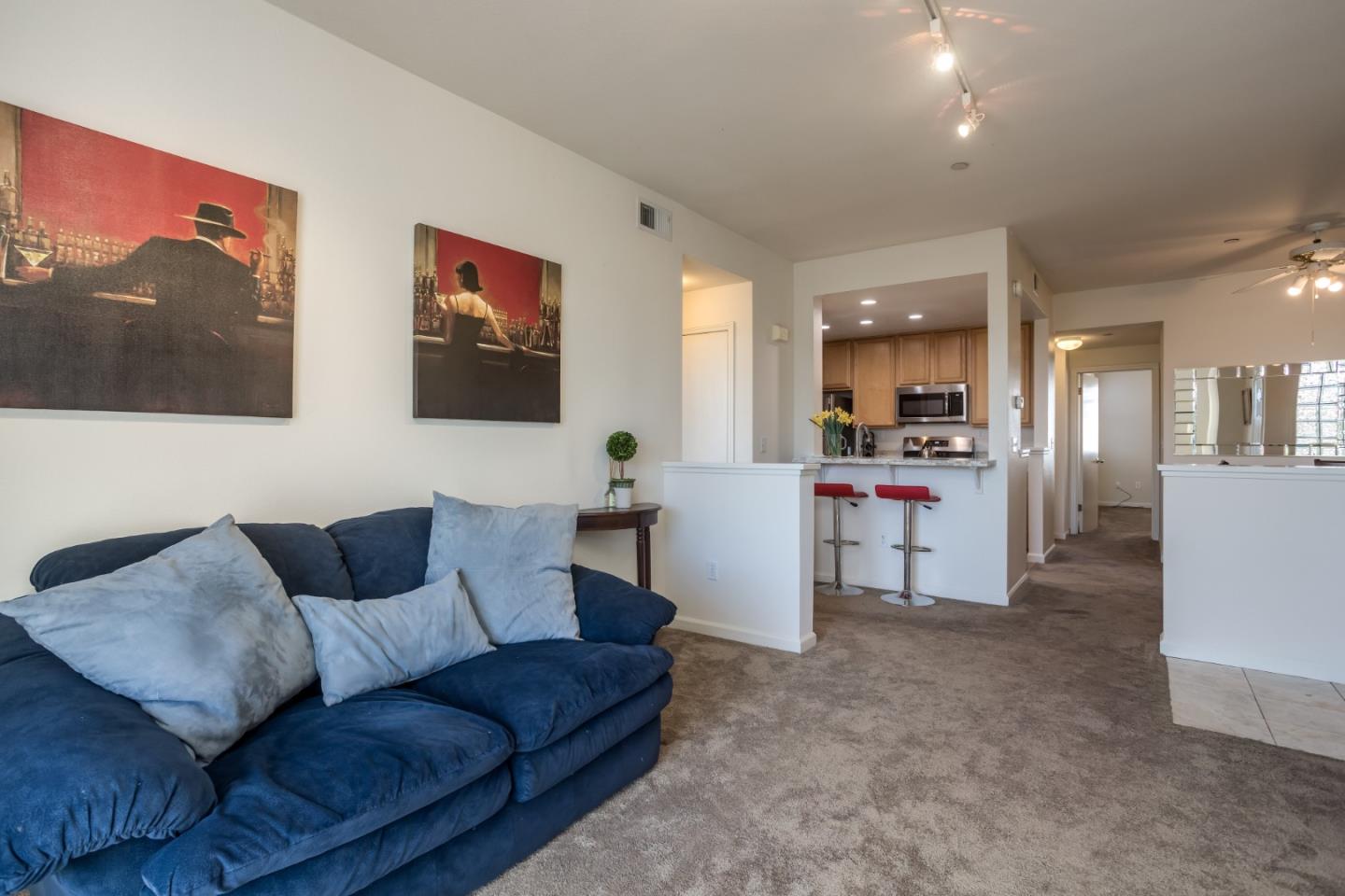 614 Arcadia Terrace, Unit 206 Sunnyvale, CA 94085 - Photo 4 of 21 a living room with furniture and kitchen view